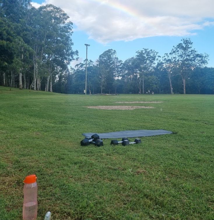 Woman Stretching Before Run — Fitness Trainer in Brisbane, QLD