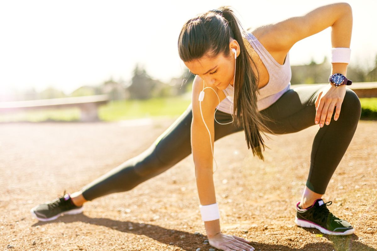 Woman Stretching Before Run — Fitness Trainer in Brisbane, QLD