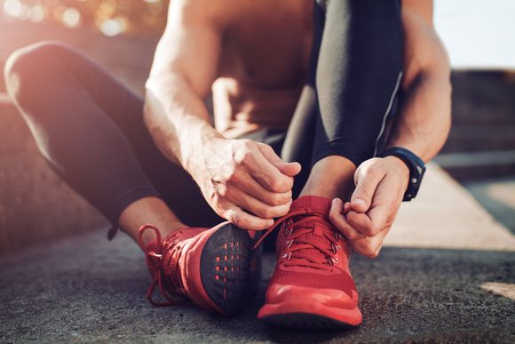 Man Tying Shoes — Fitness Trainer in Brisbane, QLD