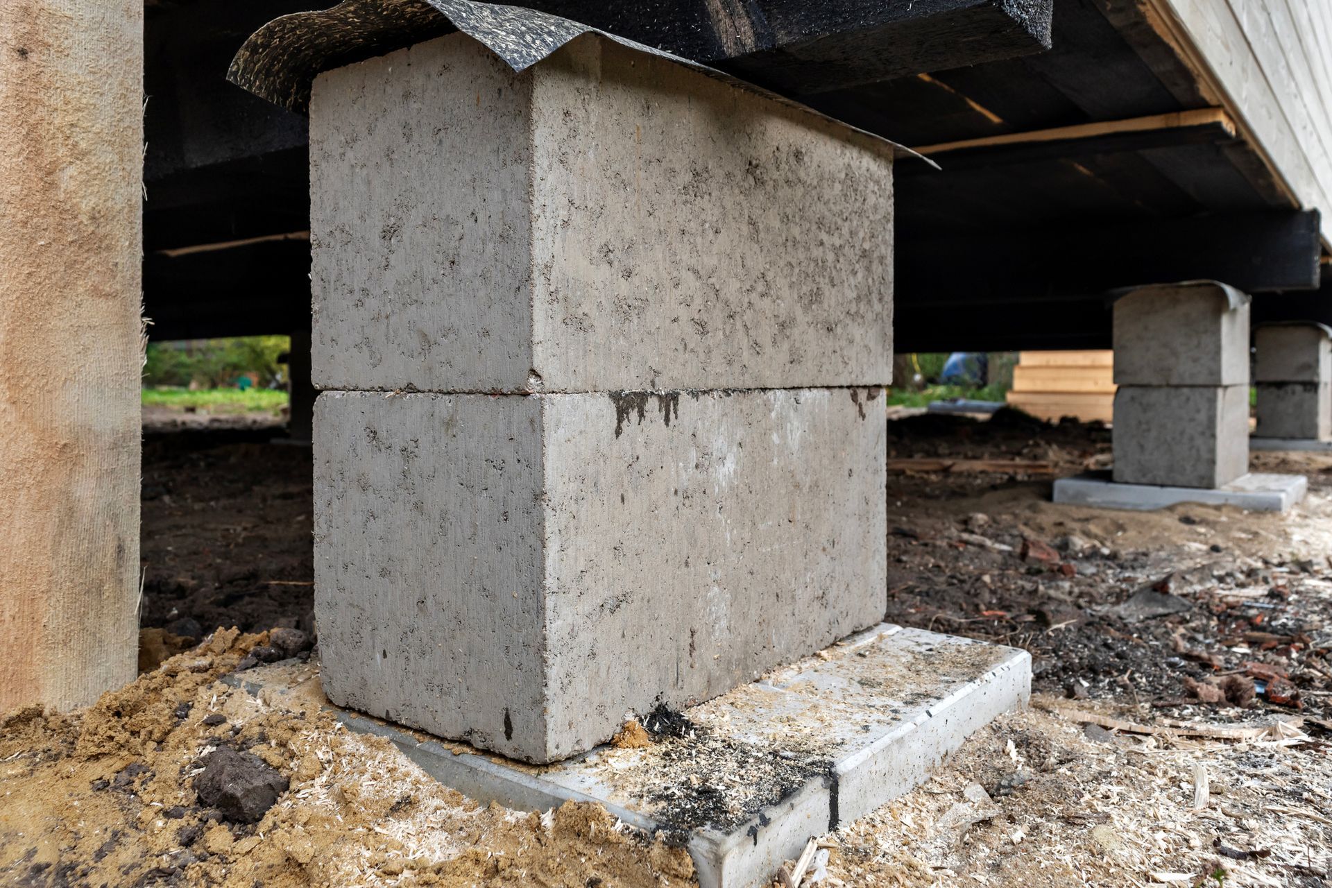 View under a house, showing the foundation stumps or foundation blocks.