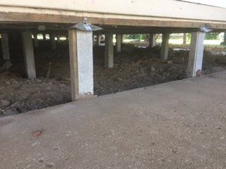 There is a lot of dirt underneath the house.