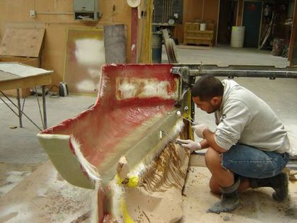 Man repairing fibreglass boat