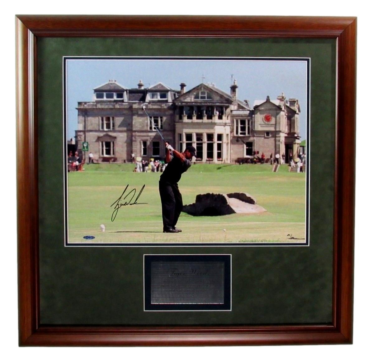 Golfer swings club at St. Andrews, signed print in wooden frame with dark green matting and inscription.