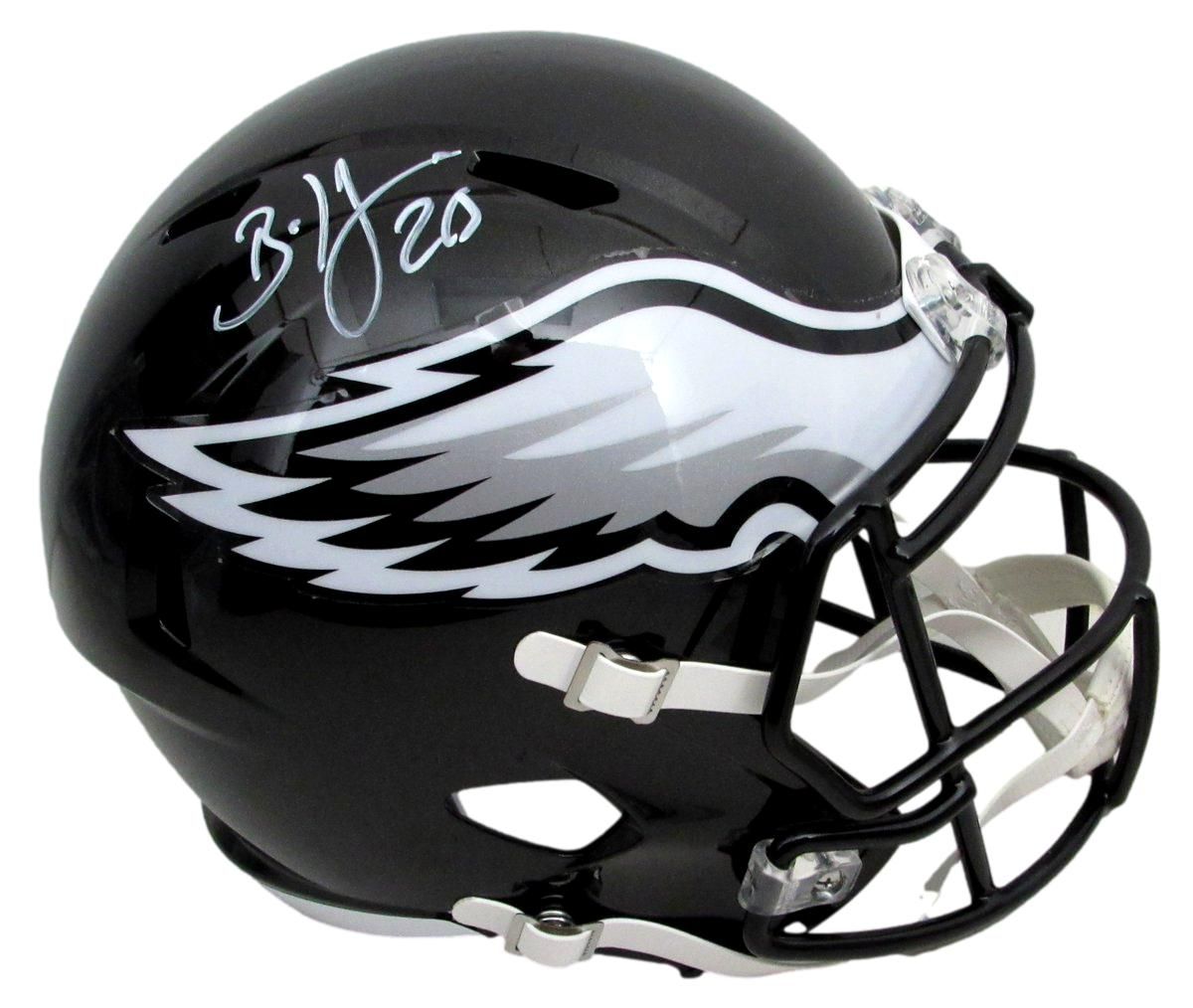 Black Philadelphia Eagles mini helmet with signature and team logo.