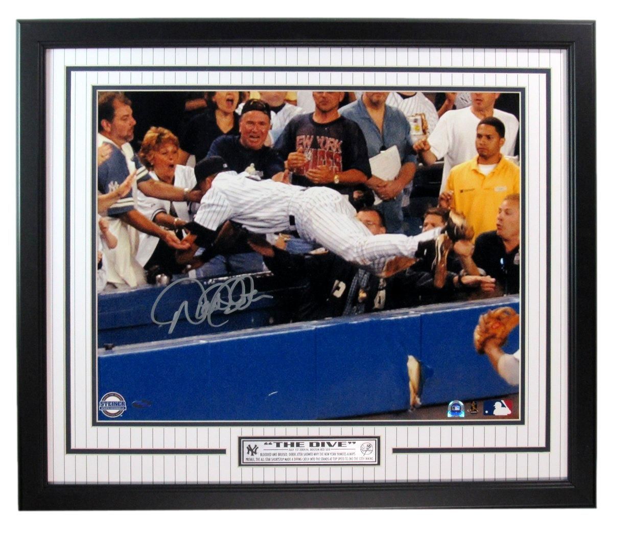Framed photo of Eric Young diving for a ball. Signature on the photo, Yankees pinstripes around the frame.