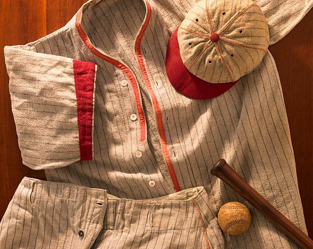 A shot of an antique pin-striped wool baseball uniform from the 20s with a matching cap and pants