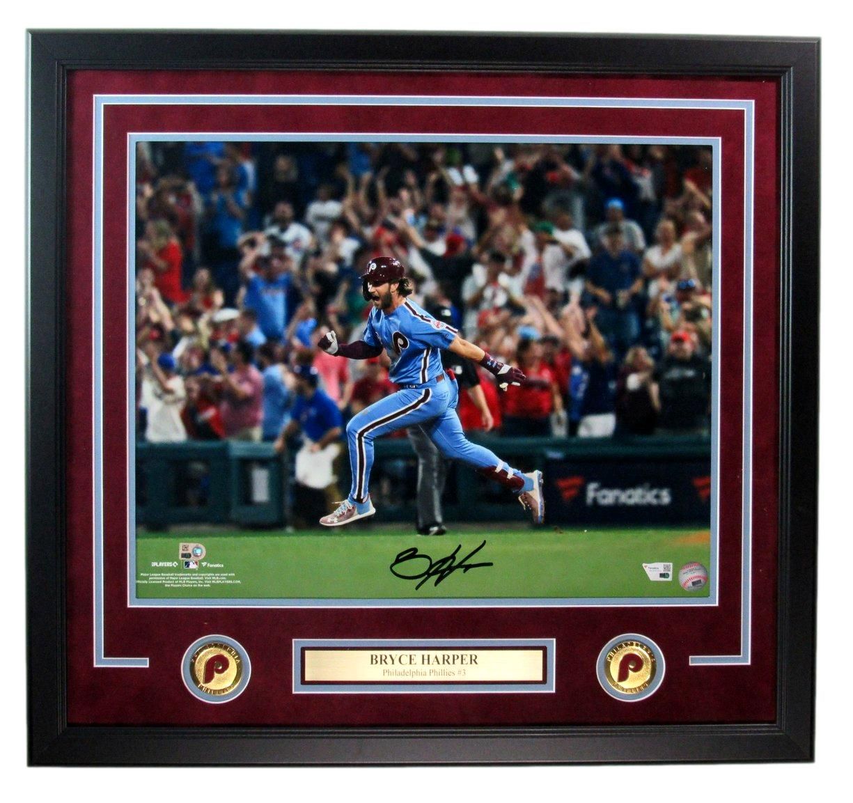 Bryce Harper running a base. Framed photo with burgundy matting, Phillies logo, and his signature.