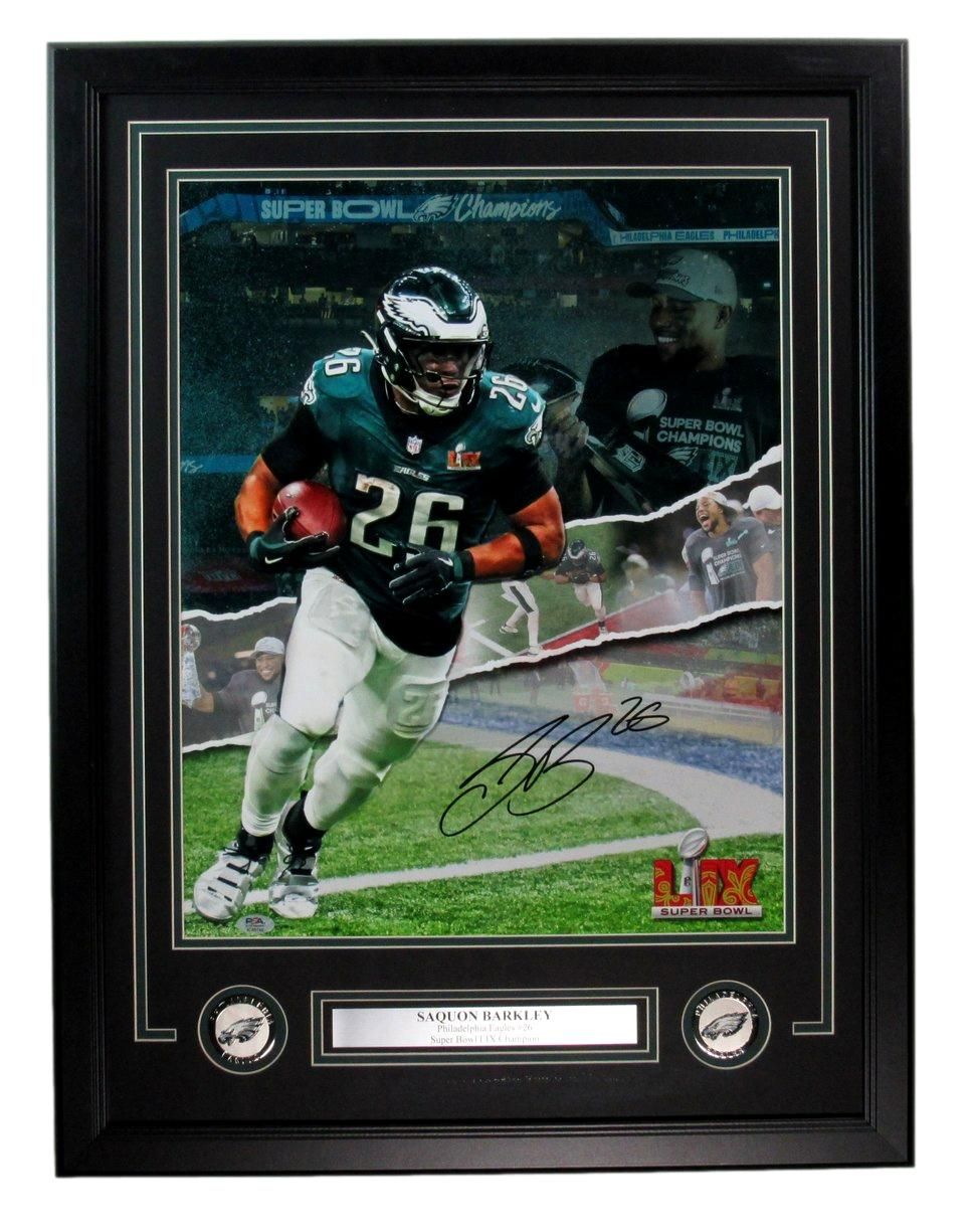 Framed Philadelphia Eagles memorabilia. Signed photo of #26 running back, with Eagles logo and Super Bowl LII insignia.
