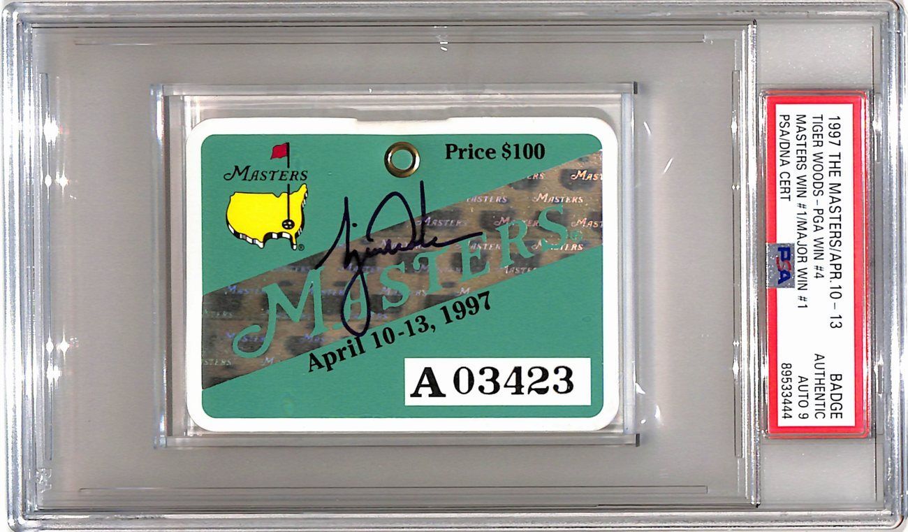 Autographed 1997 Masters ticket with signature and price. Encased in protective holder with green and gold details.