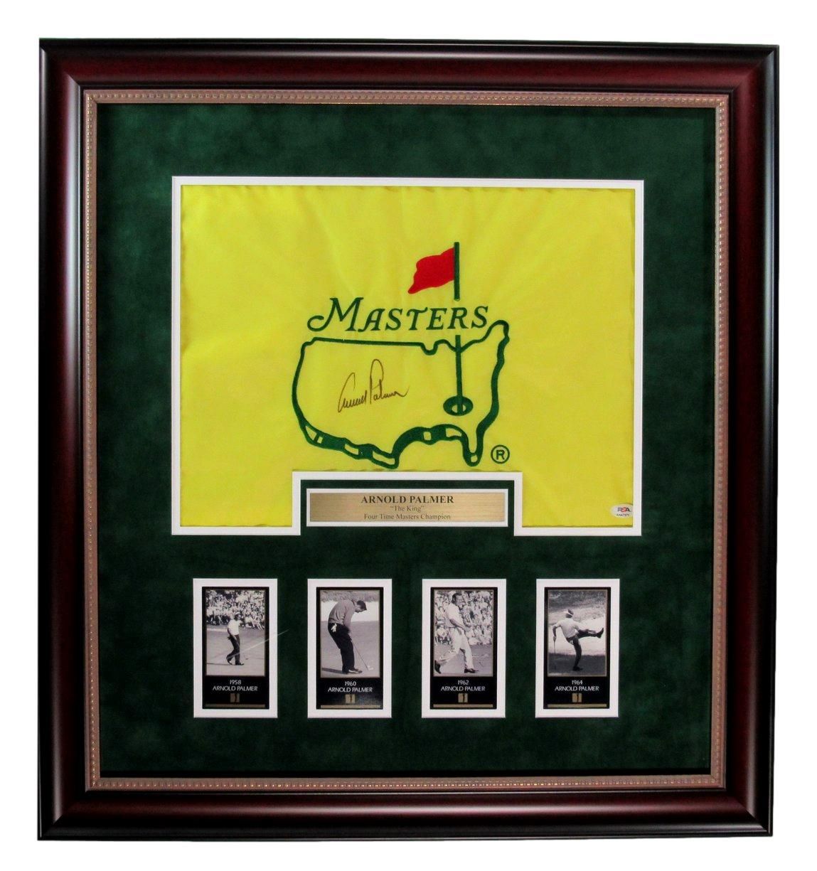 Framed Masters golf flag with signature, photos, and plaque in a green and brown frame.