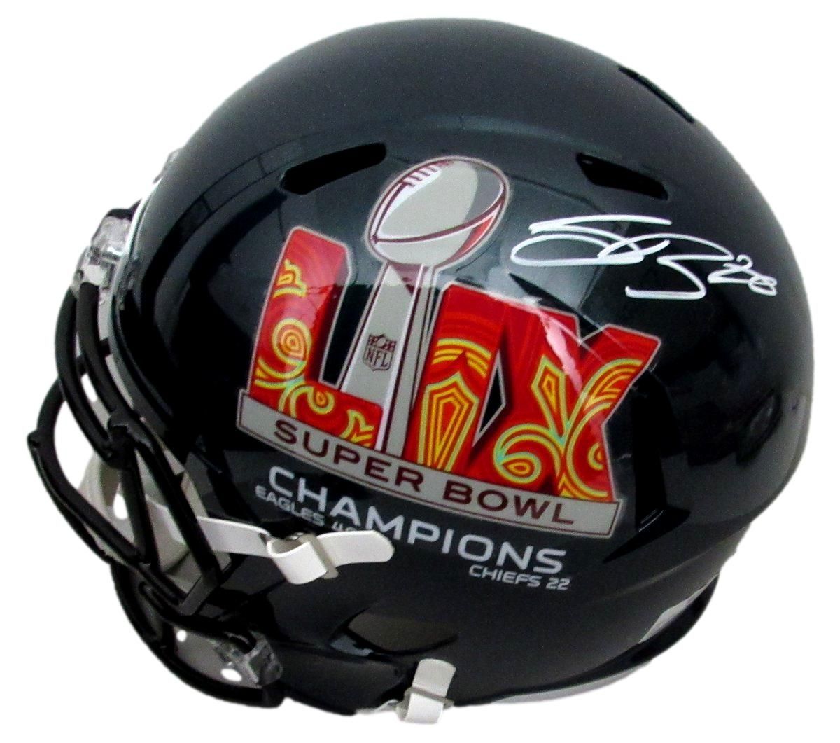 Black football helmet with Super Bowl LIV Champions logo and signature.