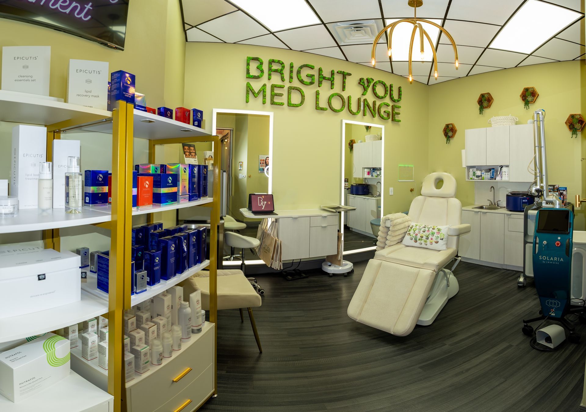 Bright You Med Lounge interior: Medical spa with treatment chair, shelves of products, and equipment.