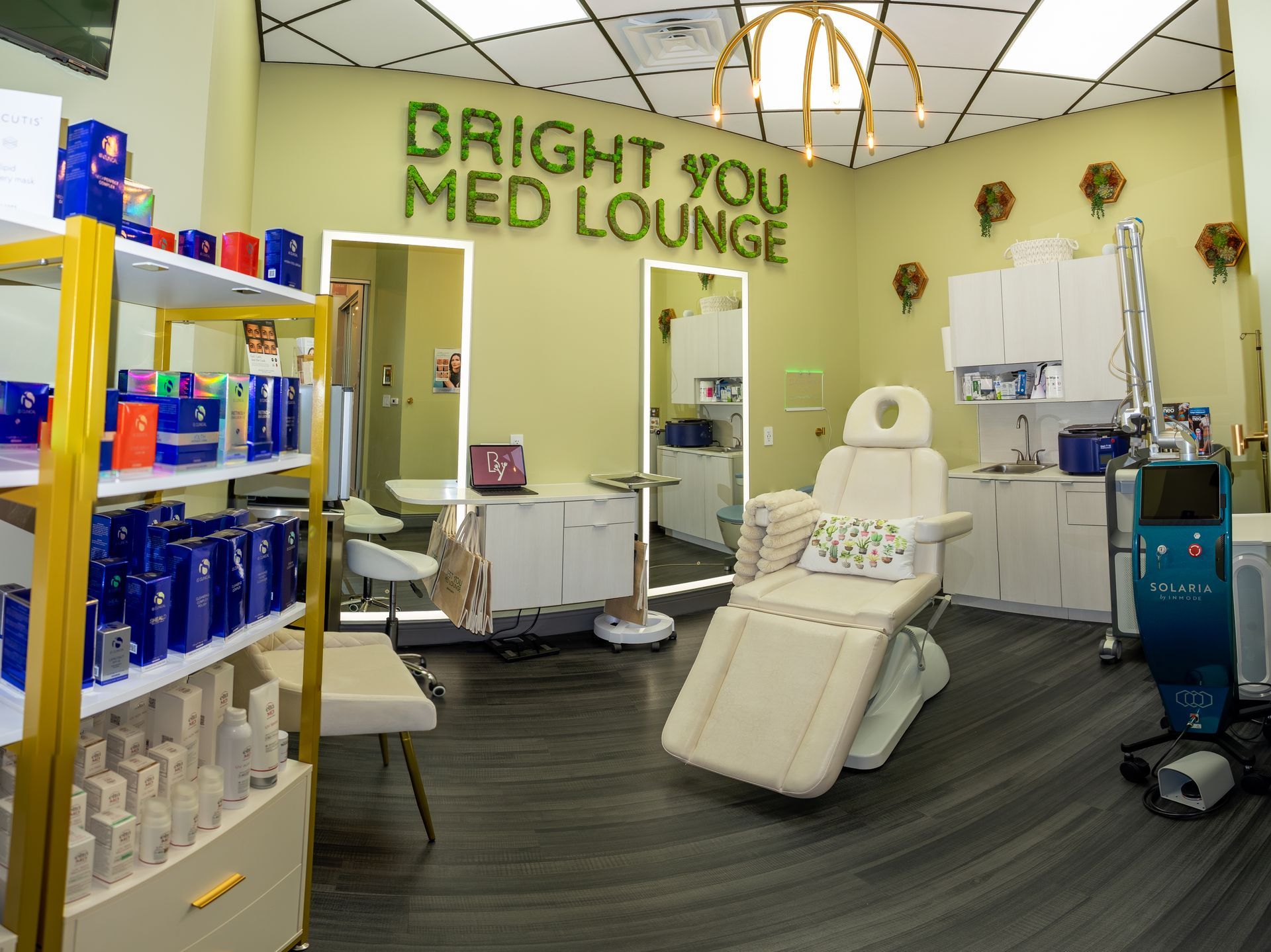 Bright You Med Lounge interior with medical equipment, products, and treatment chair.