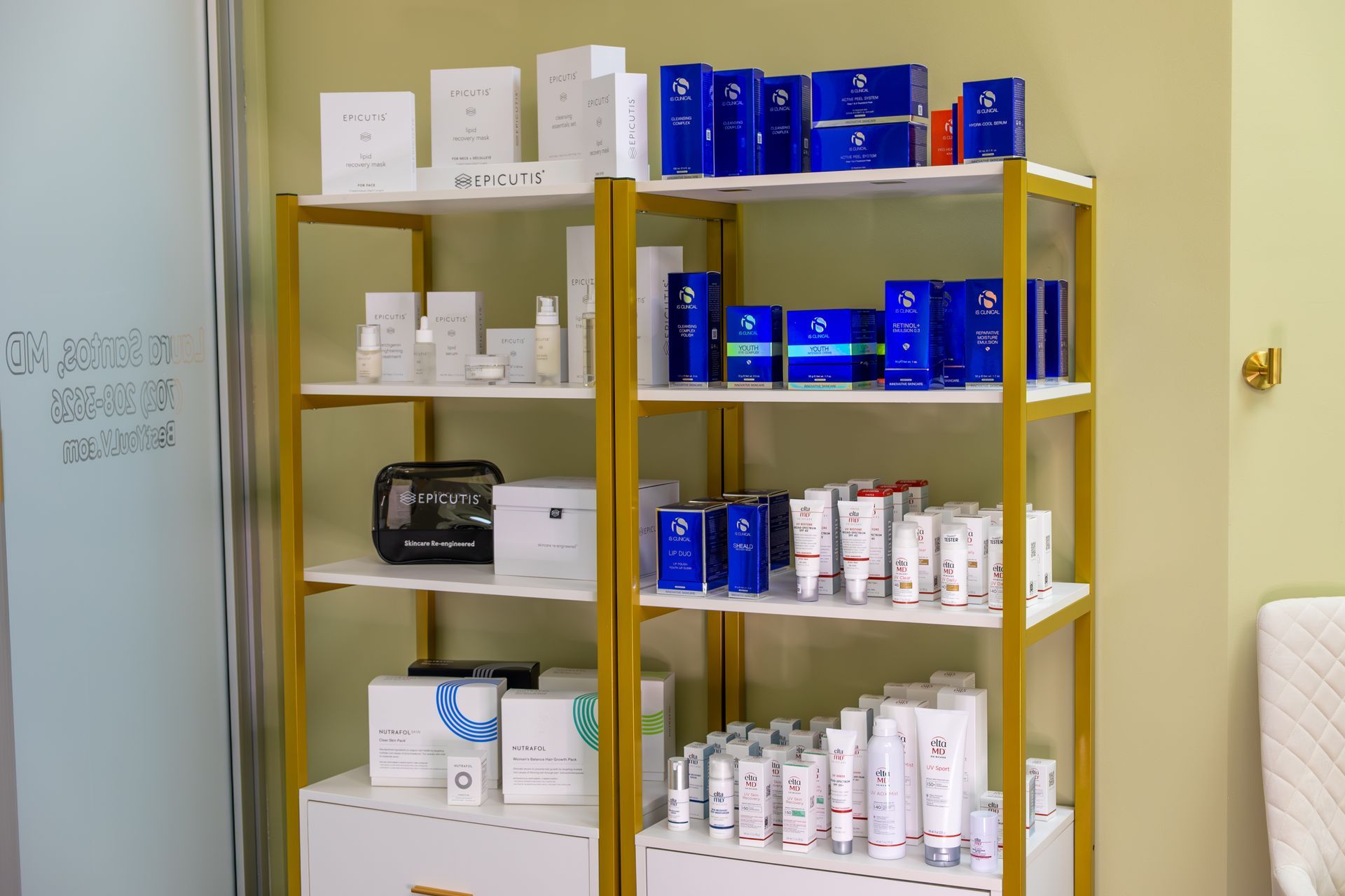 A shelf filled with a variety of beauty products in a store.
