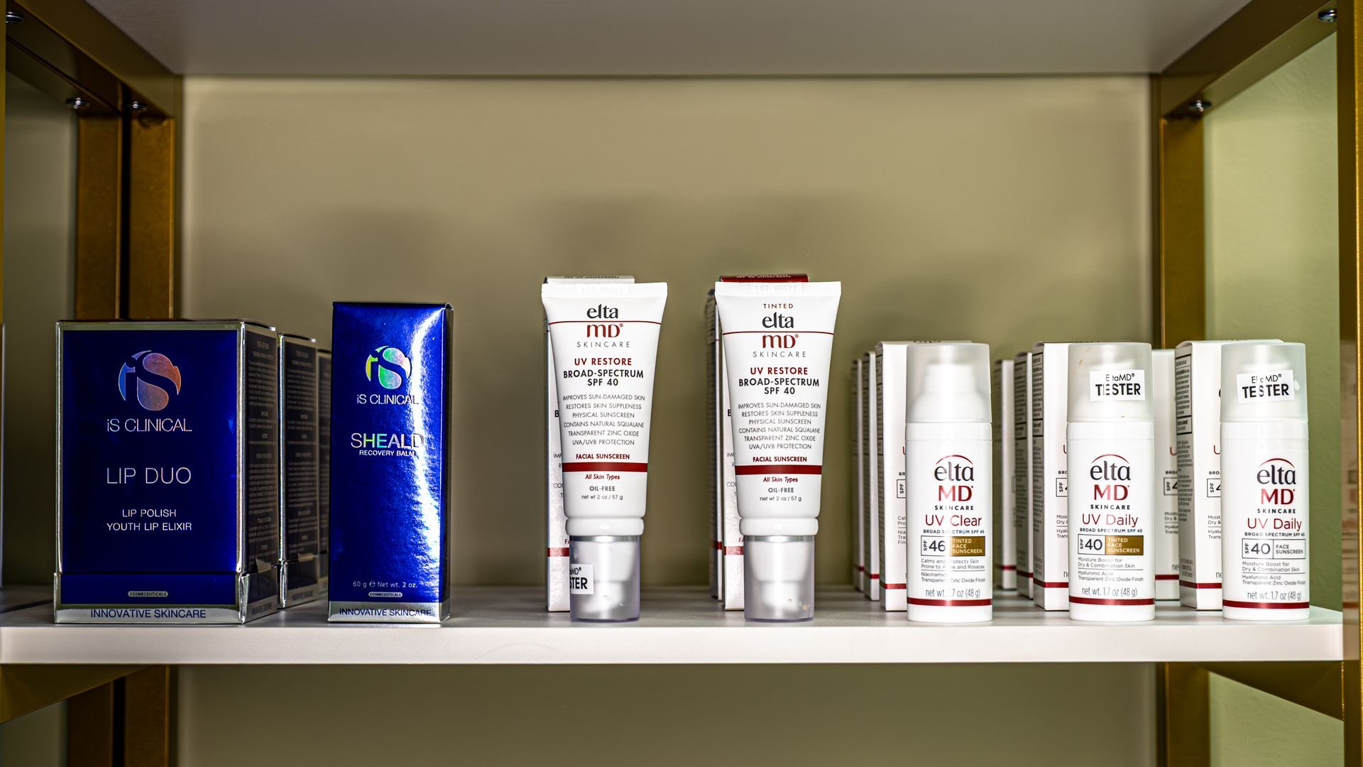 A shelf filled with a variety of beauty products