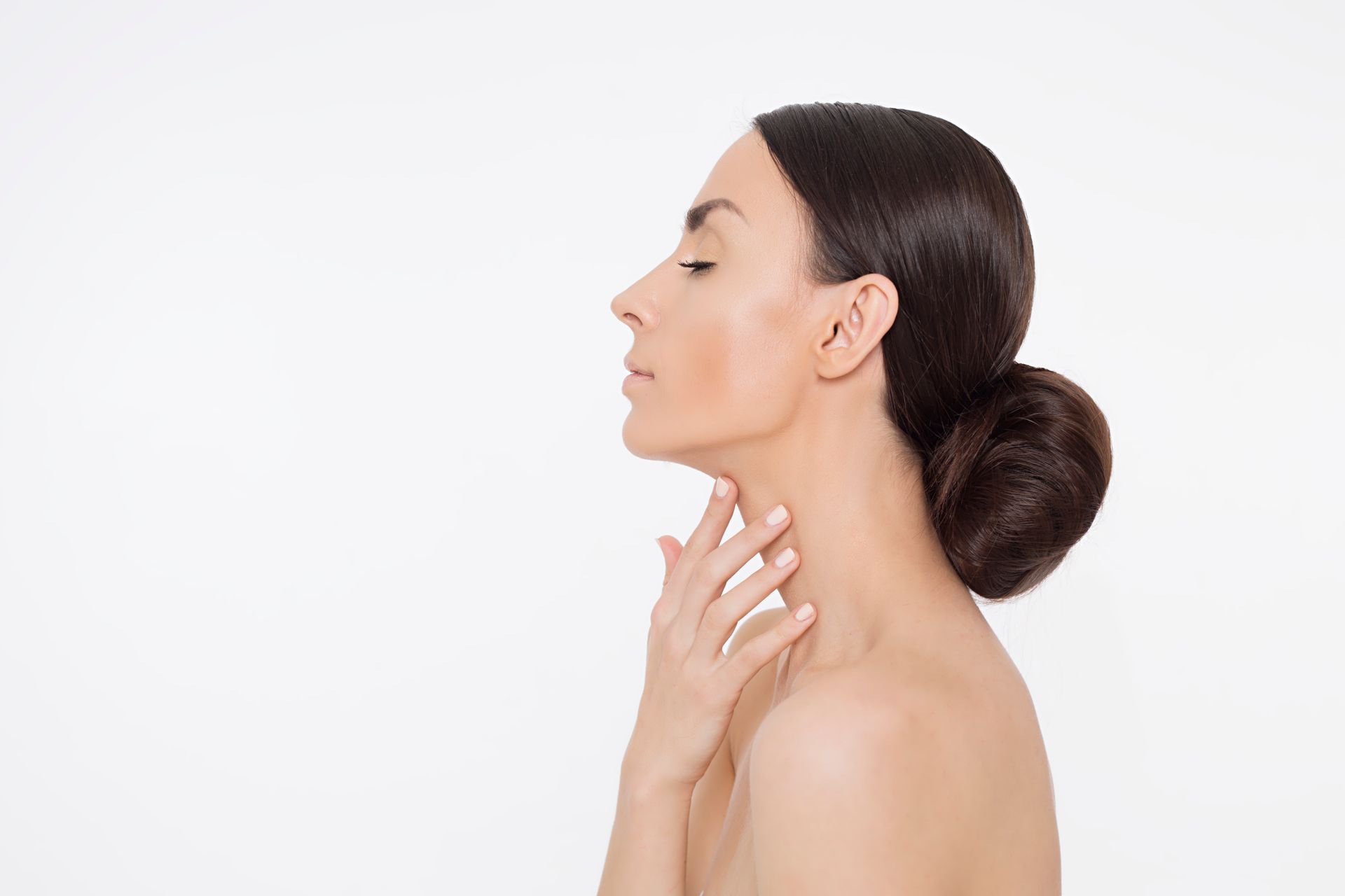 a woman touching her neck