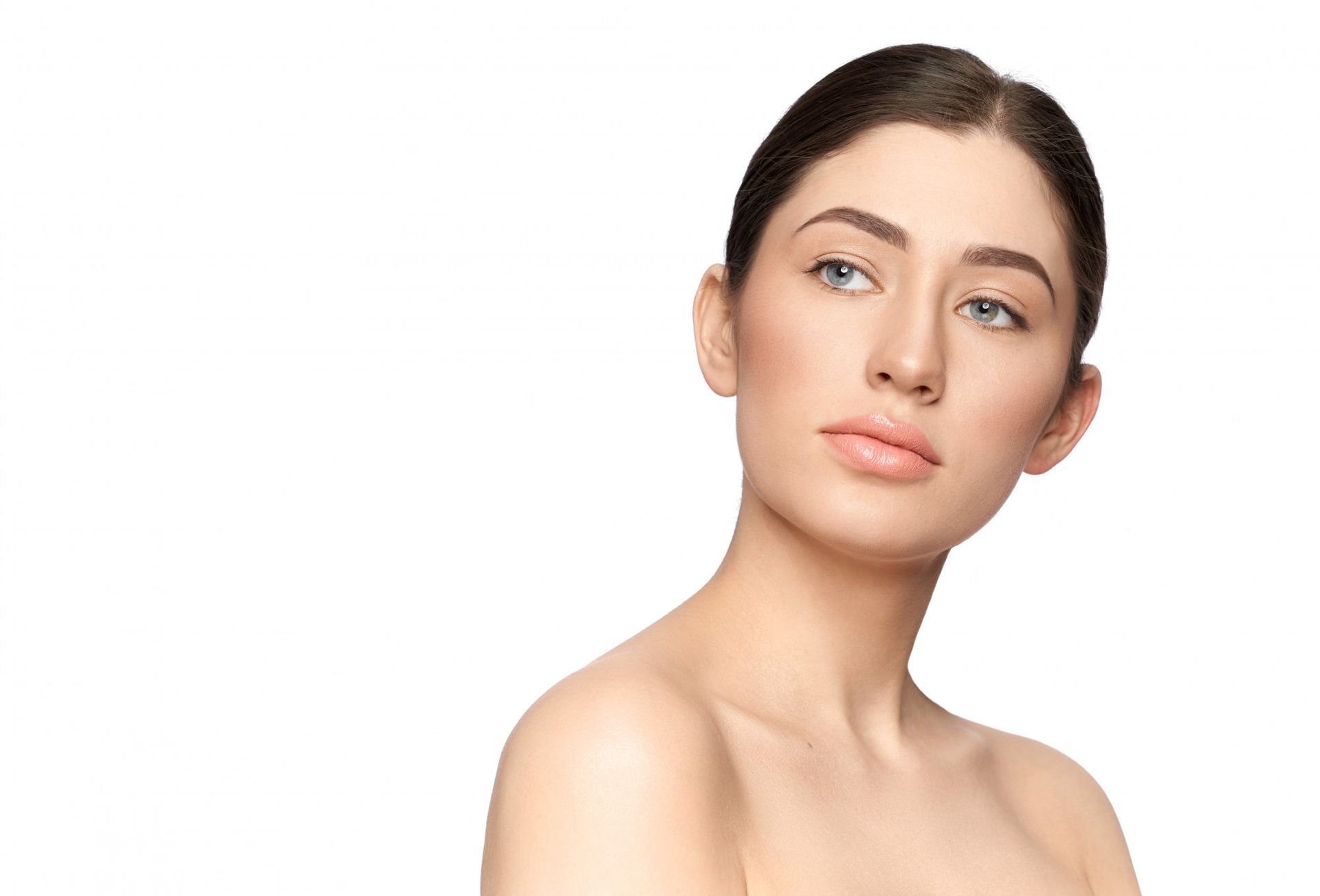 A close up of a woman 's face on a white background.