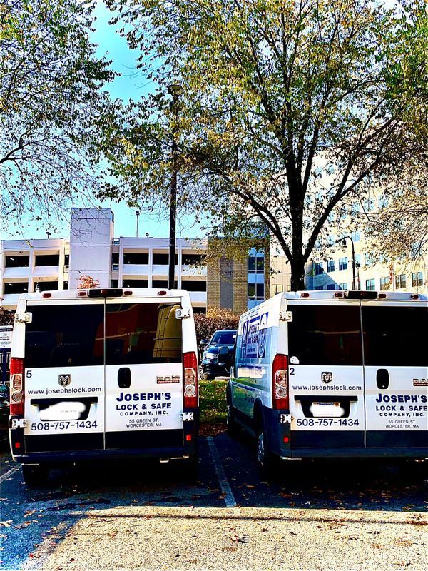Two joseph 's moving vans are parked in a parking lot
