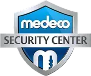 The logo for medeco security center is a shield with a key on it.