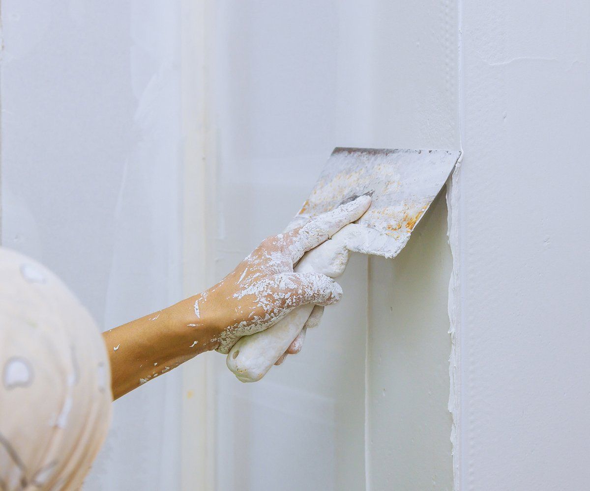 Person Doing Drywall Repair — Longmont, CO — Francia's Painting LLC