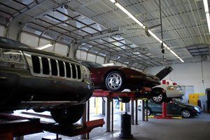 Cars Inside Automotive Shop — Fairless Hills, PA — RPM Tire & Auto Center