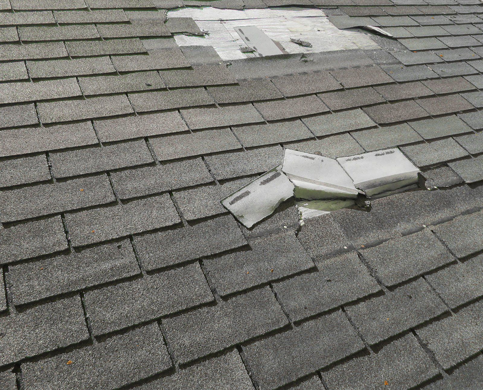 A close up of a roof with a hole in it.