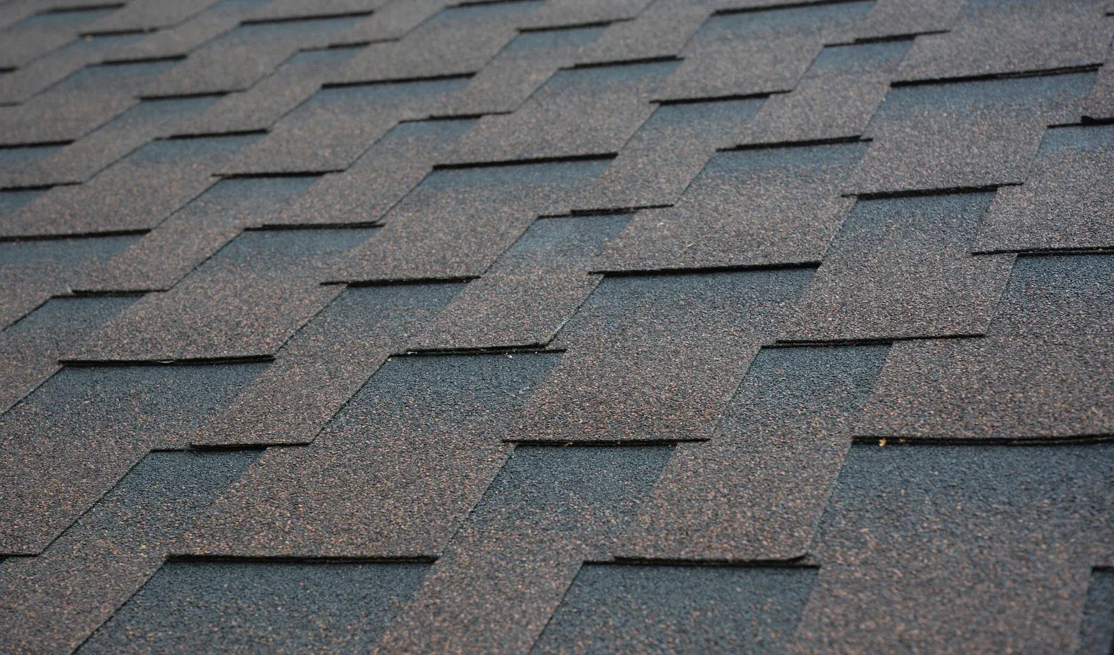 A close up of a roof with shingles on it