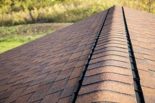 A close up of a roof with shingles on it.
