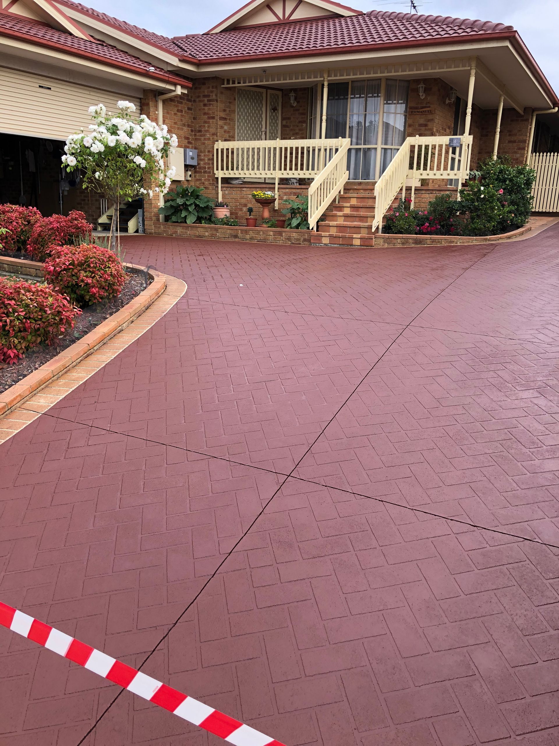 A large stencil pattern driveway in Berwick after Melbourne Concrete Sealing have cleaned and colour sealed it with Prime exposure sealer.