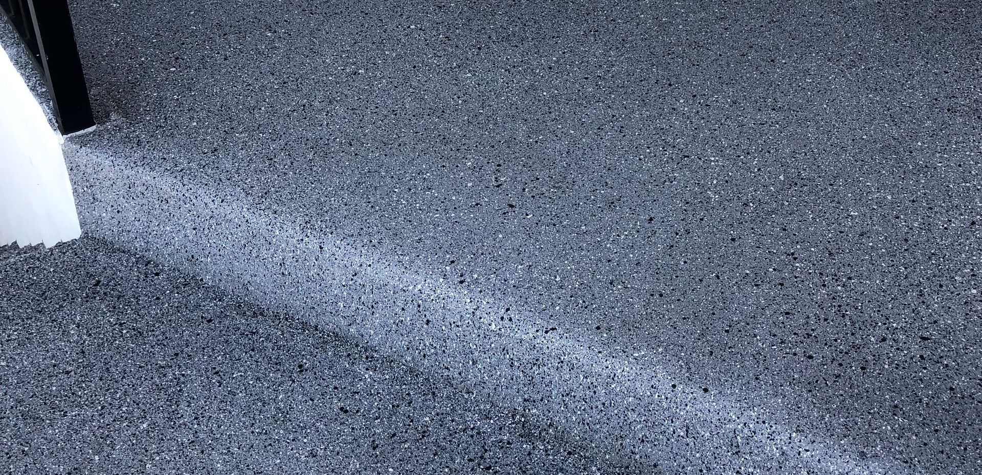 A close up of a gray carpet texture.