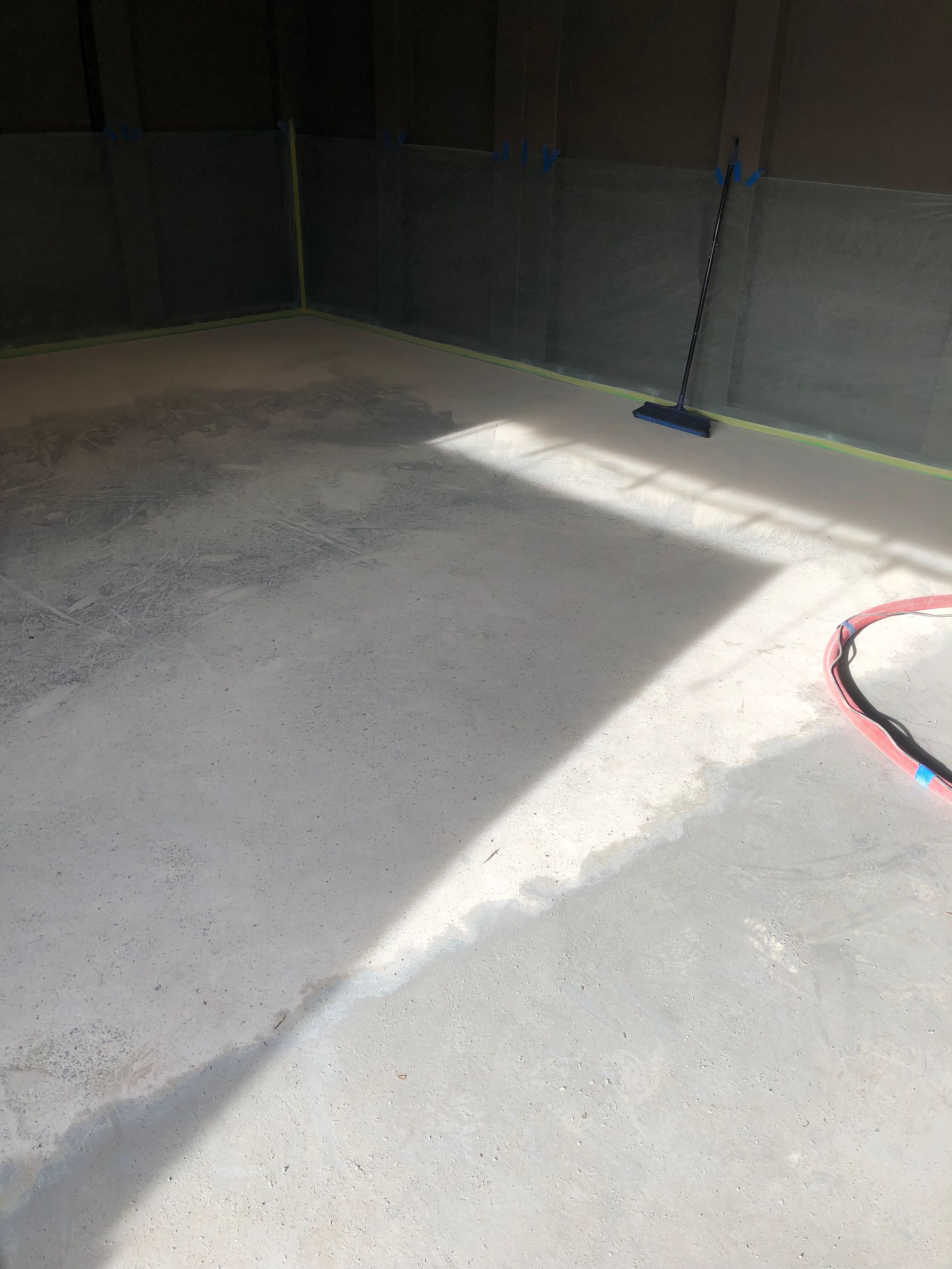 A close up of a gray carpet with a lot of small dots on it.