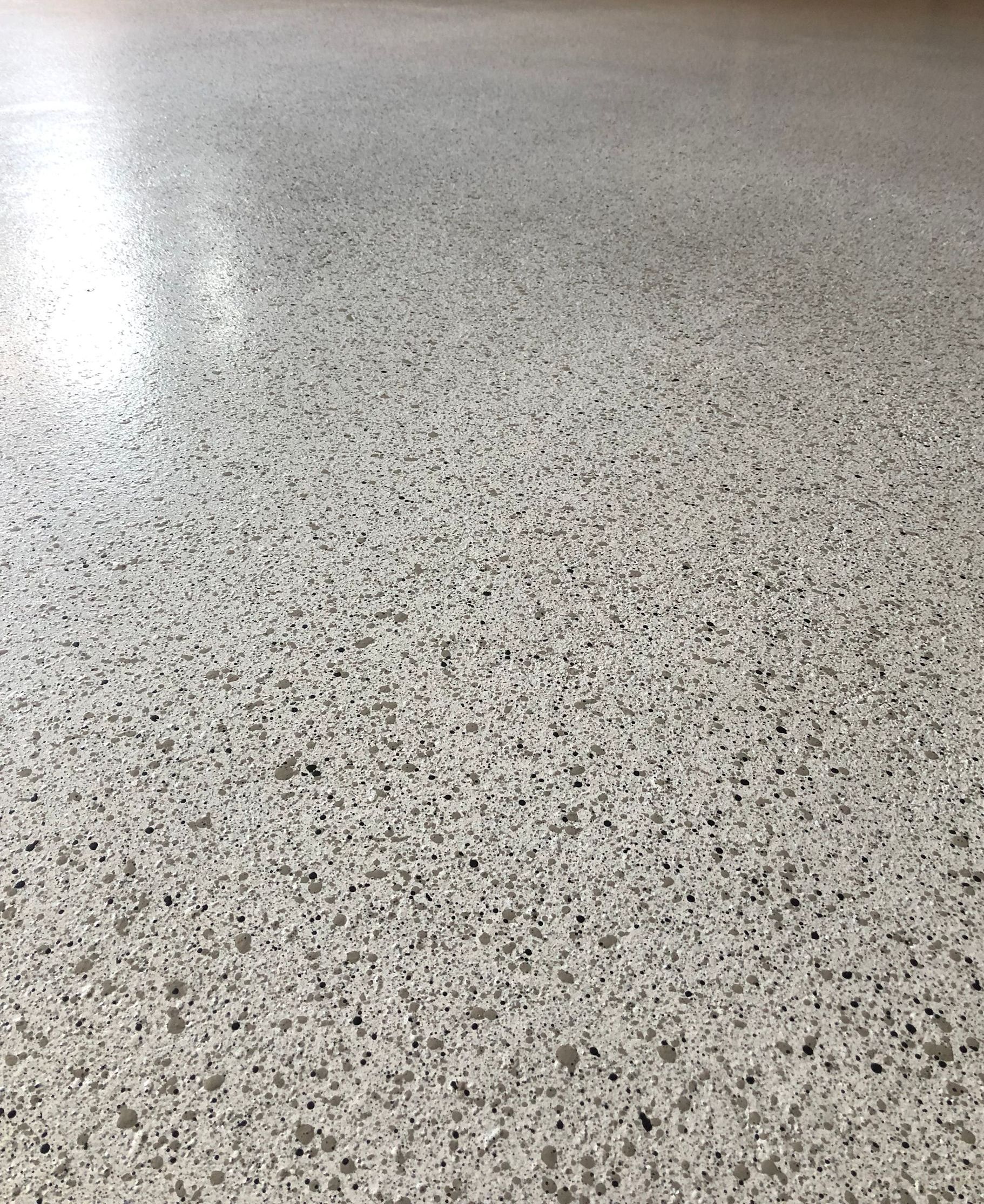 Garage floor with Epoxy showcasing Melbourne Concrete Sealings stippled stone look