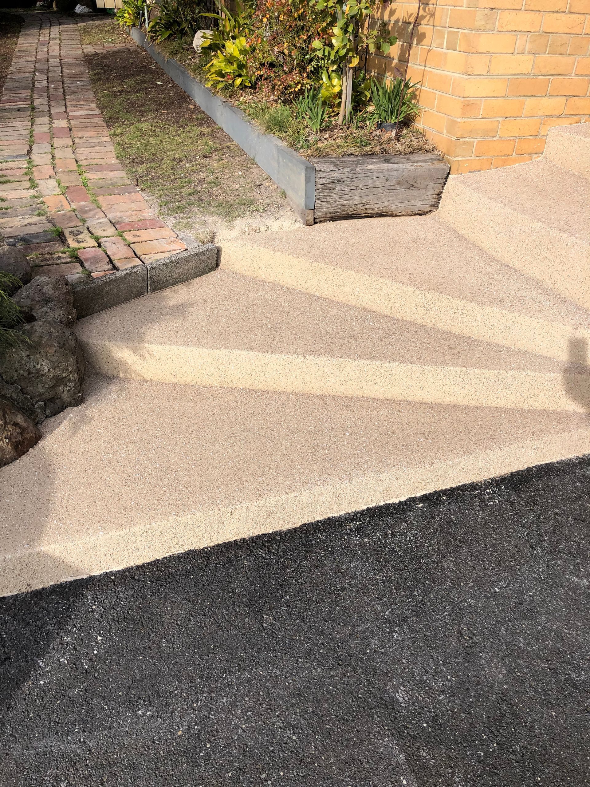 Spiral concrete staircase Resurfacing transformation with custom colour created by Melbourne Concrete Sealing in Pakenham 