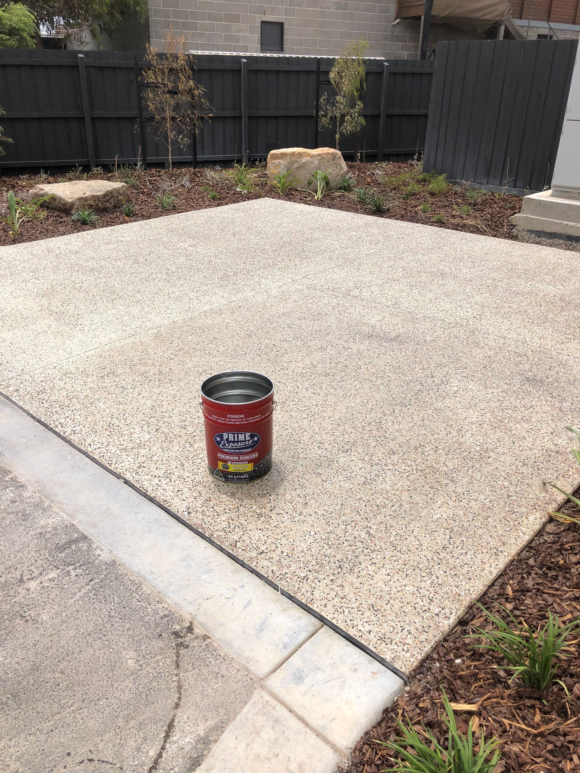 Commercial exposed aggregate concrete sealing project for a premium apartment development in Port Melbourne by Melbourne Concrete Sealing.