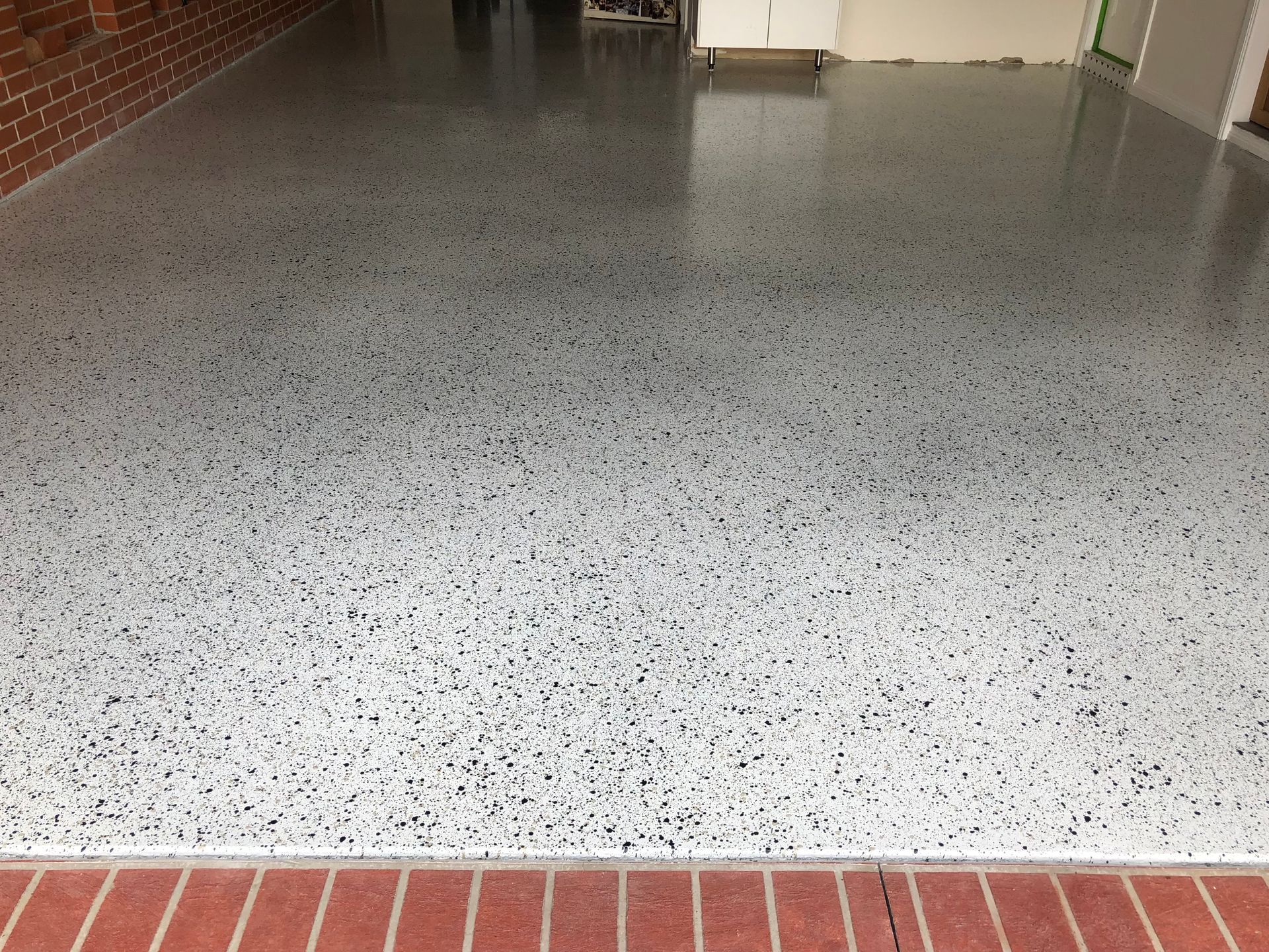 Signature Stunning Epoxy System in Stippled Stone finish for Aspendale garage by Melbourne Concrete Sealing and Resurfacing.