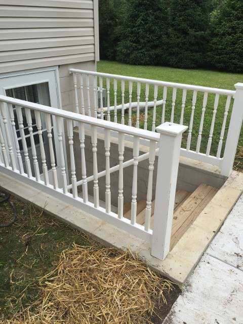 White Fence and Ladder - home renovation in Duncansville, PA