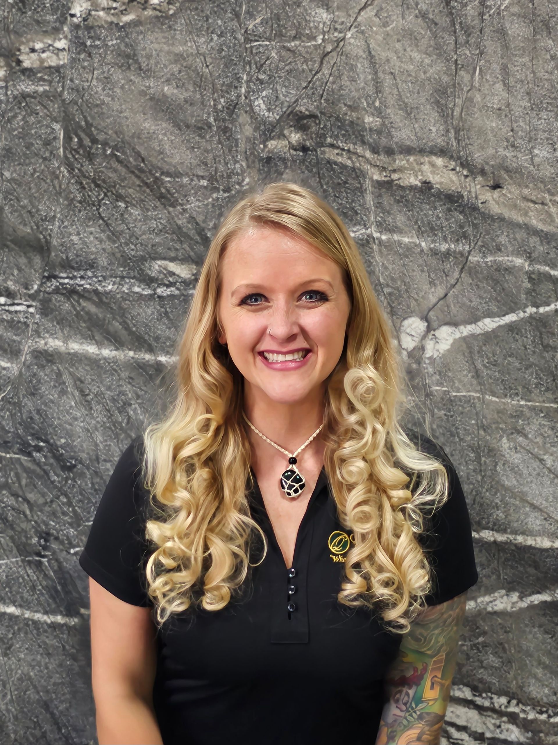 A black and white icon of a person in a circle.