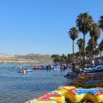 A group of people are floating on rafts in the water.