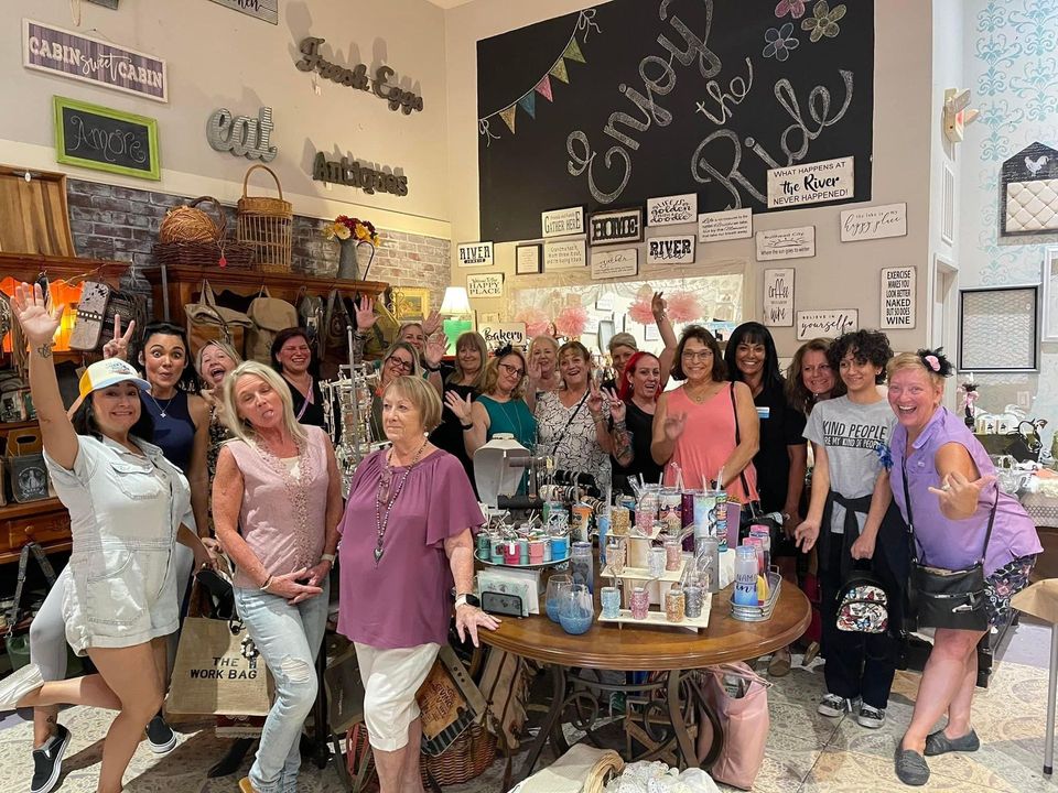 A group of women are posing for a picture in a store.