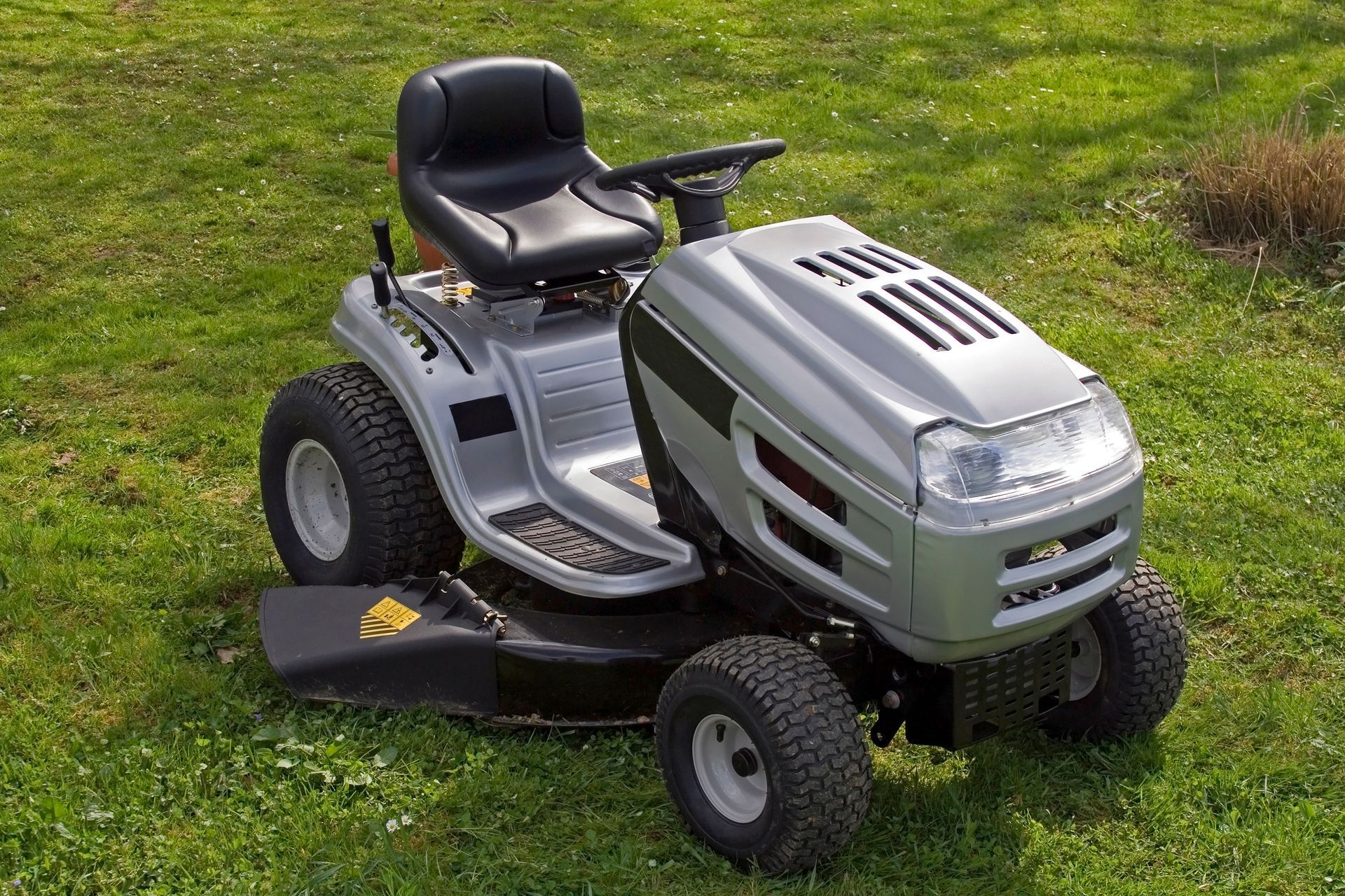 Small tractor for cutting lawn.