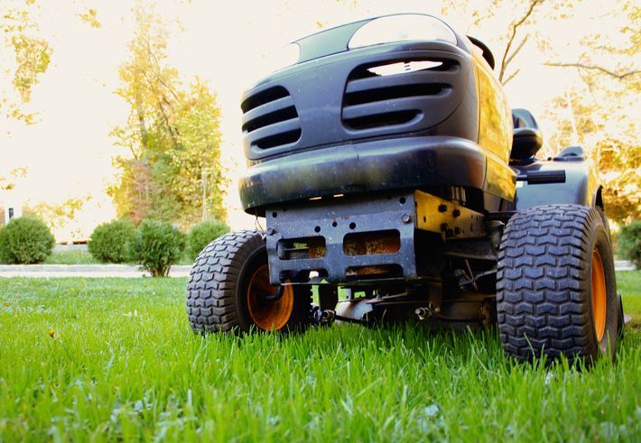 Garden tractor displayed in yard by trusted local lawn tractor dealer.