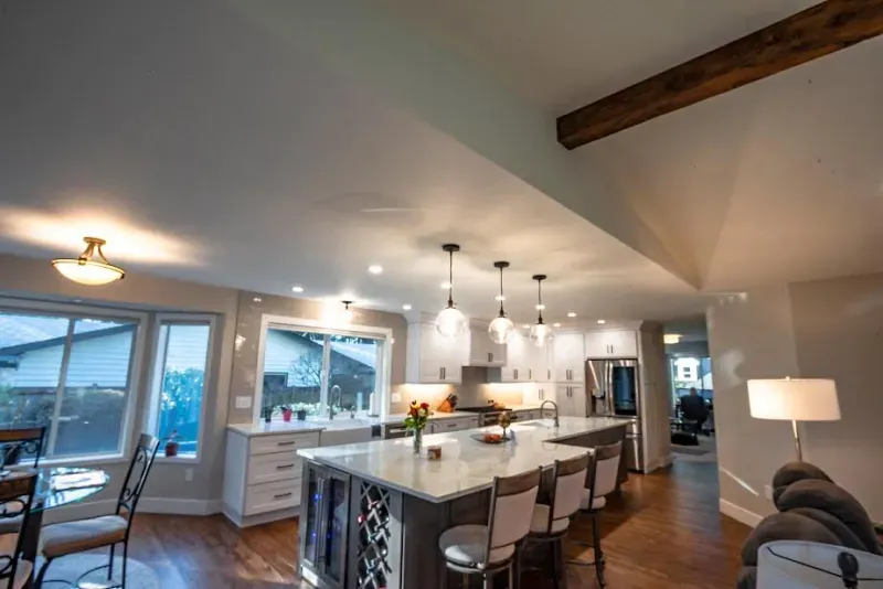 A kitchen with a large island in the middle of the room.