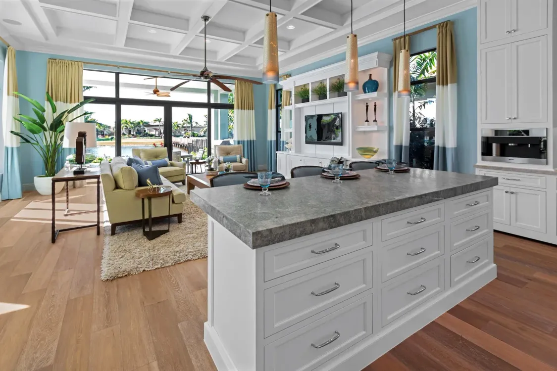 A kitchen with a large island in the middle of the room.