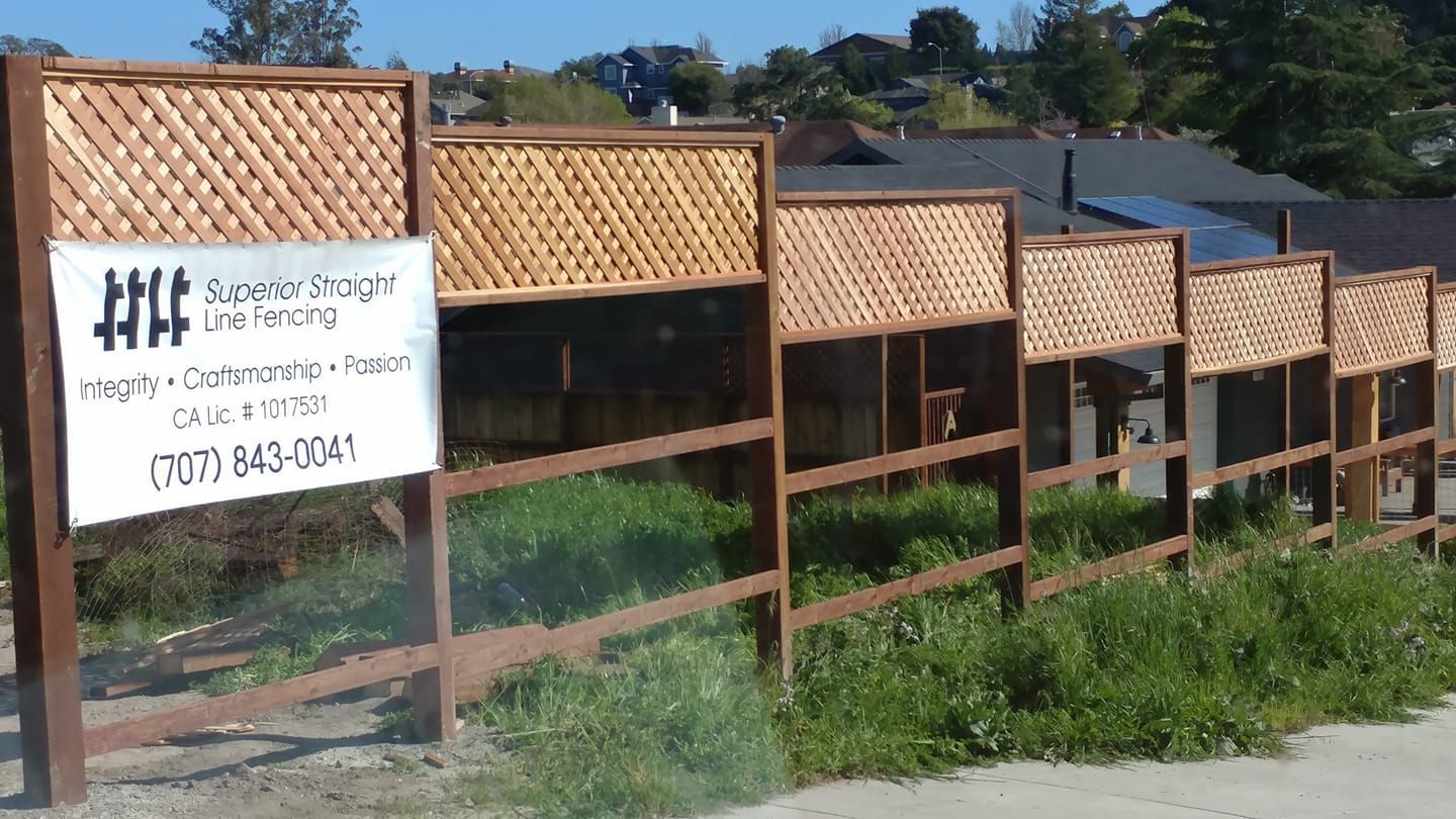 A wooden fence with a sign that says superior thought