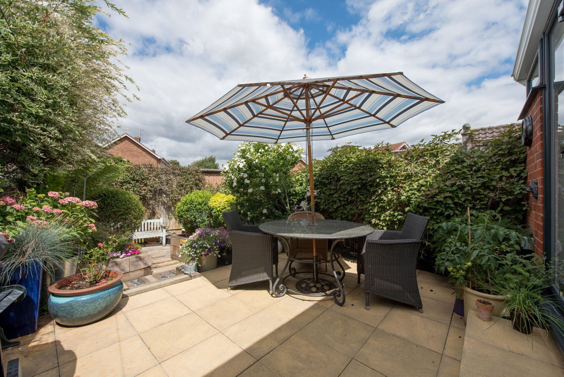 Patio Surrounded By Bushes | Gilberts, IL | Crown Tree Care Inc.