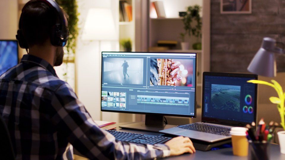 man working on  computer during post production