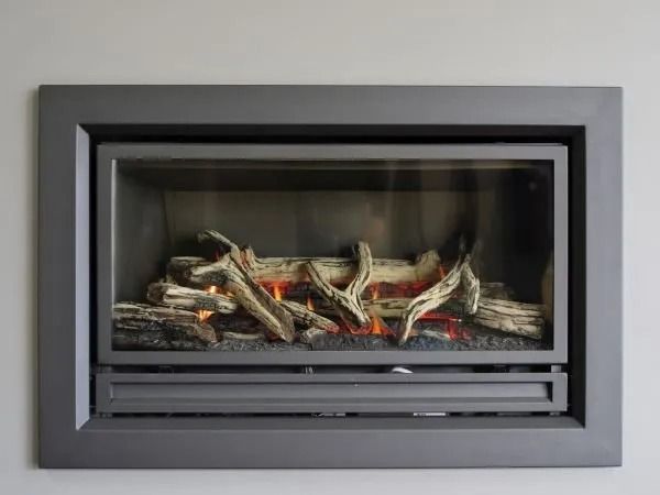 A Fireplace With a Lot of Logs in It is Hanging on a Wall — BJ Heating & Cooling in South Albury, NSW