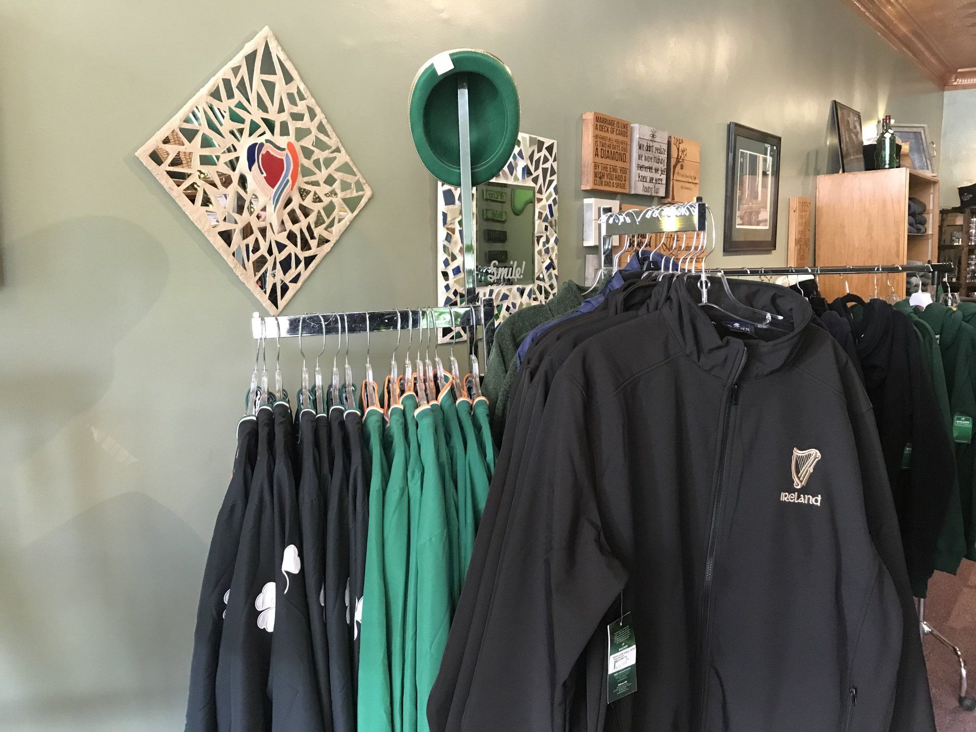 a display of clothes including a black jacket with the letter f on it