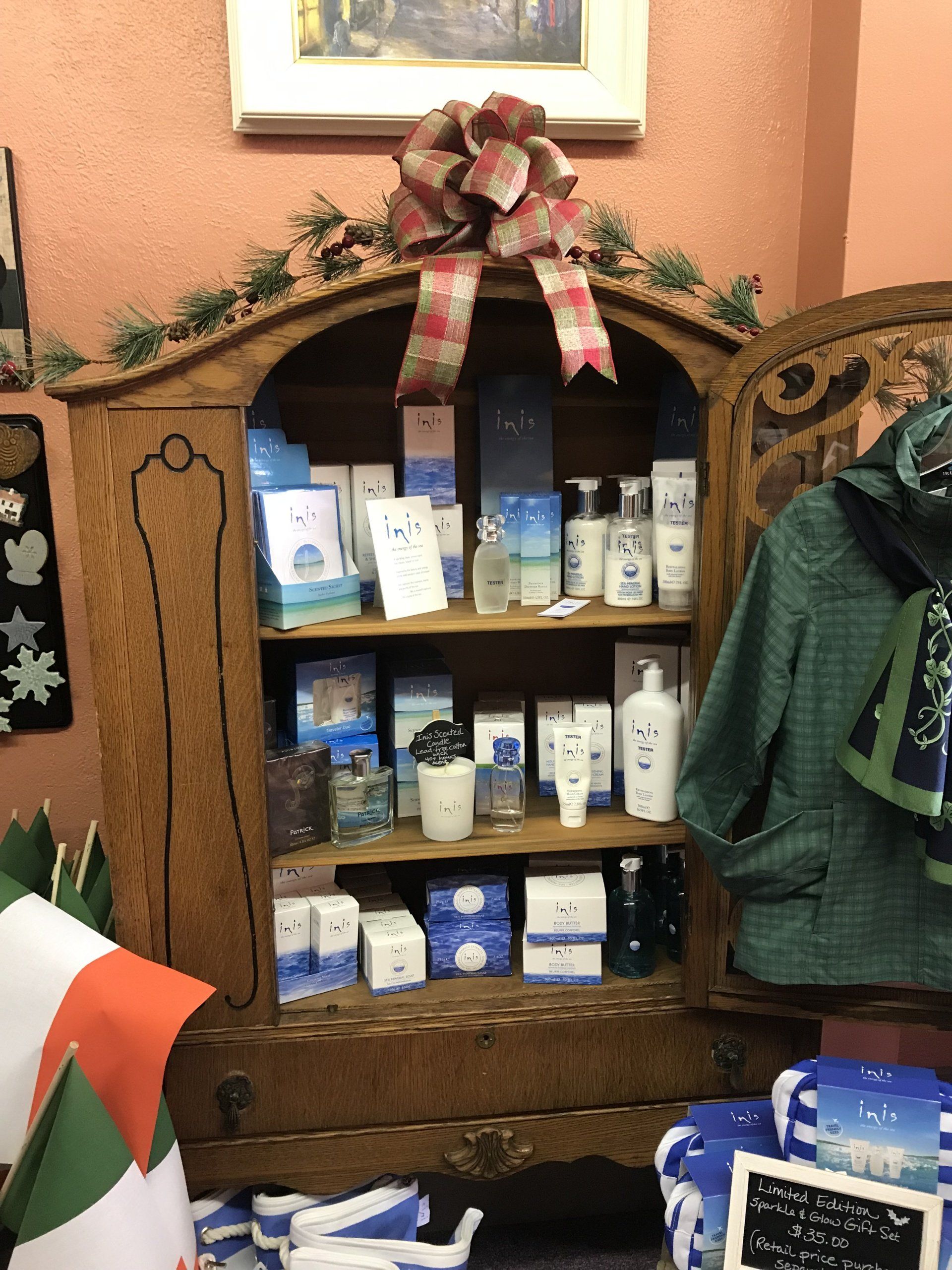 a shelf filled with various items including a green jacket