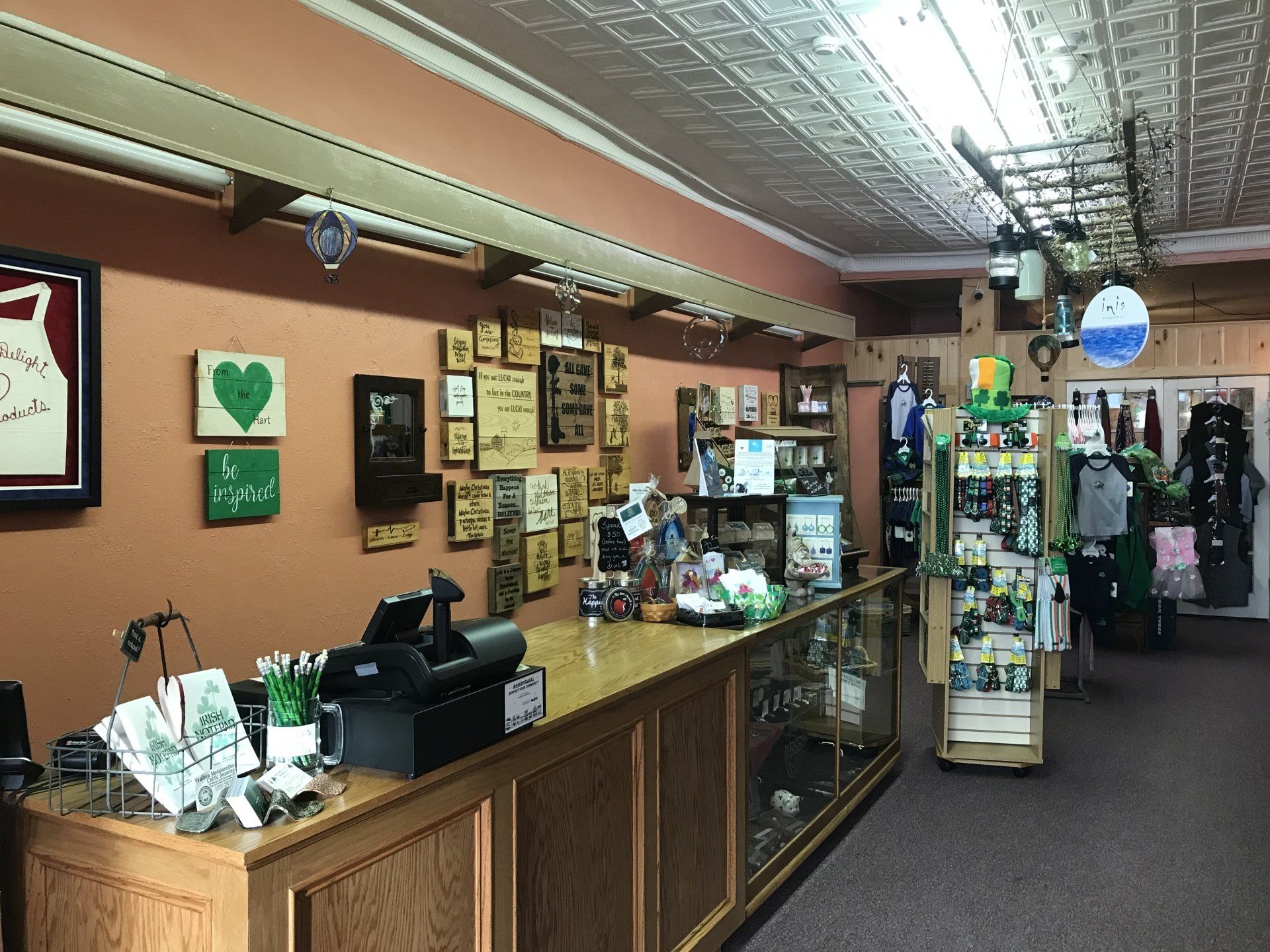 the inside of a store with a counter and a cash register .
